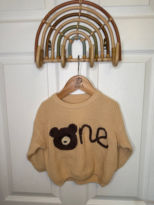 One jumper with teddy bear